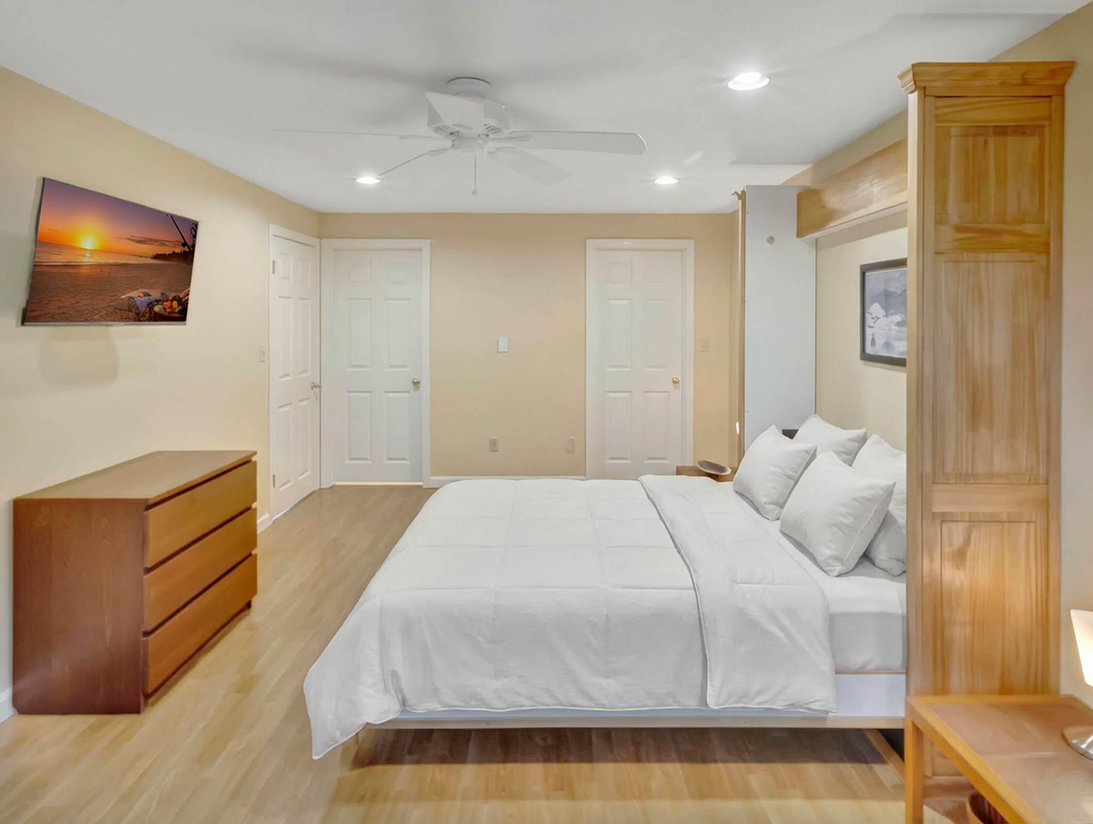 10 Kettle Lane Mashpee, MA 02649 - Photo 26 of 31 a bedroom with a bed and a flat screen tv