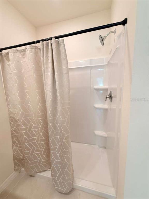 2518 Trinidad Road Haines City, FL 33844 - Photo 11 of 17 a bathroom with a shower