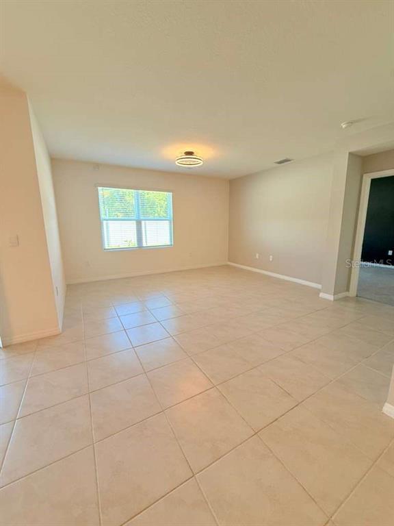 2518 Trinidad Road Haines City, FL 33844 - Photo 9 of 17 an empty room with windows
