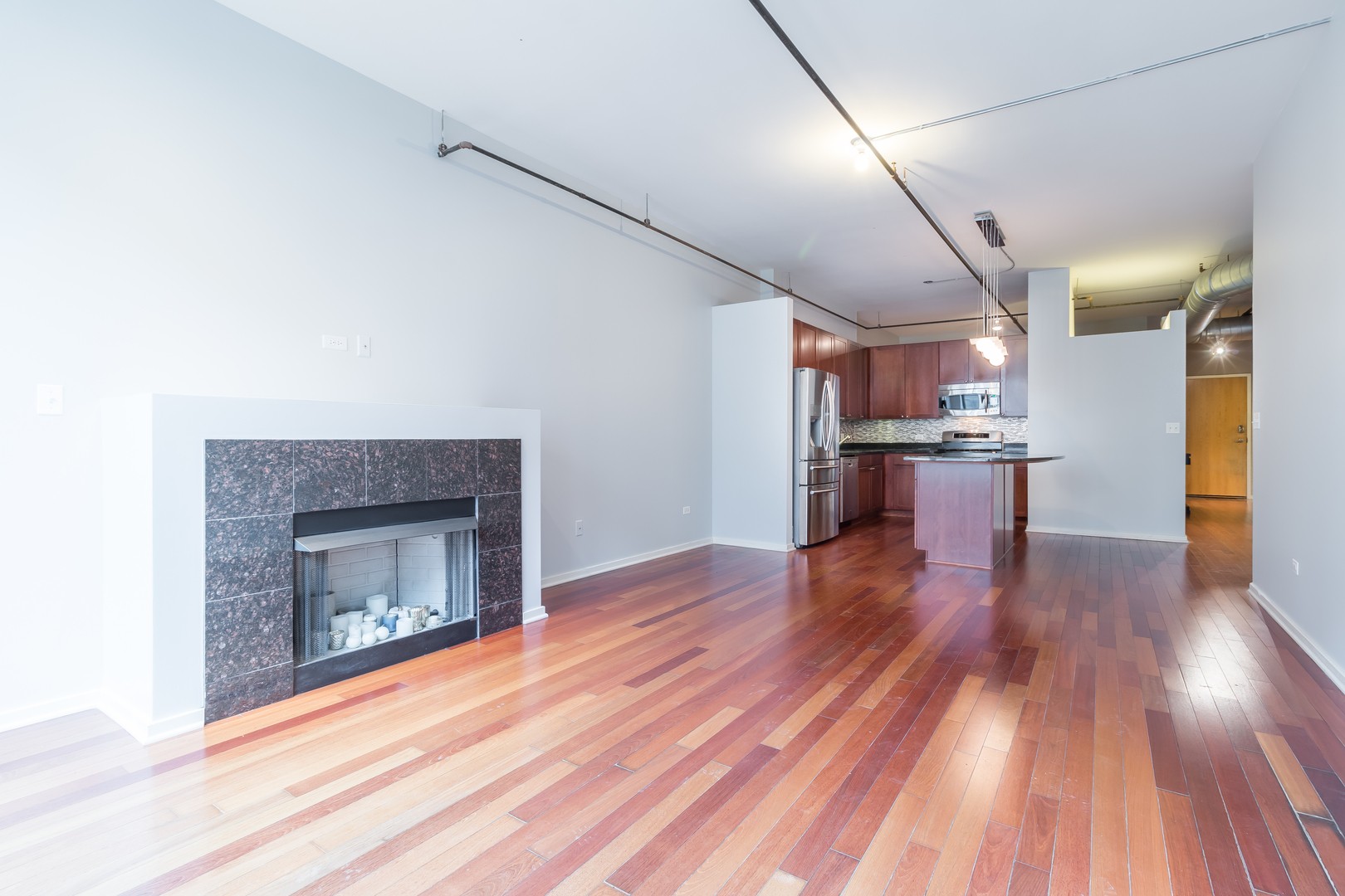 520 South State Street, Unit 1403 Chicago, IL 60605 - Photo 16 of 19 a view of empty room with wooden floor and kitchen