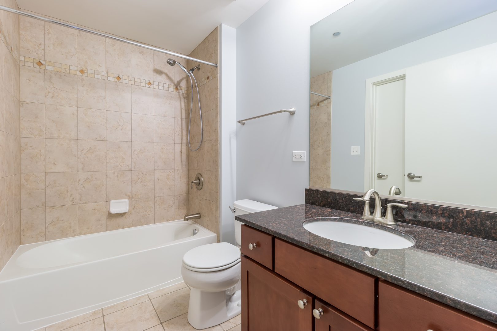 520 South State Street, Unit 1403 Chicago, IL 60605 - Photo 10 of 19 a bathroom with a granite countertop sink toilet and shower