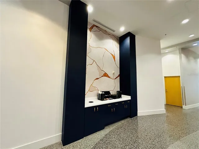 a bathroom with a sink a toilet and vanity