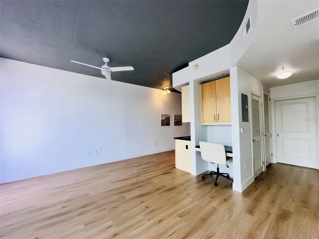 a bathroom with a granite countertop sink tub shower and a mirror