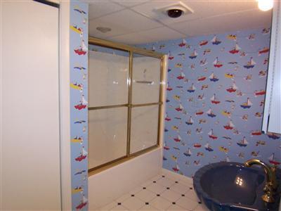 66 Holly Point Road Centerville, MA 02632 - Photo 24 of 26 a bathroom with a sink a toilet and shower