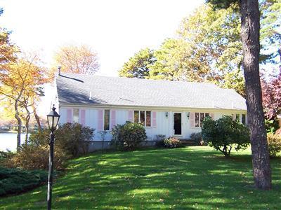 66 Holly Point Road Centerville, MA 02632 - Photo 3 of 26 a view of a house with backyard and a tree