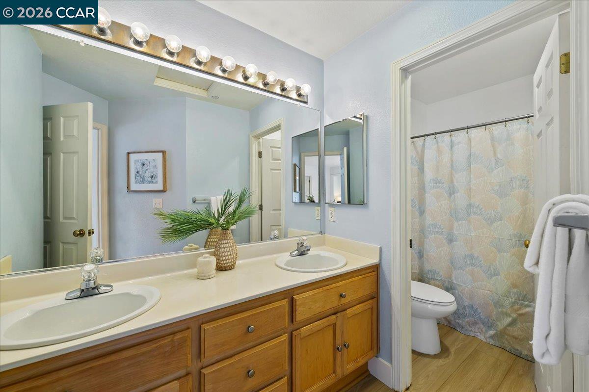 7323 Croy Lane Dublin, CA 94568 - Photo 31 of 33 a bathroom with a double vanity sink toilet and shower