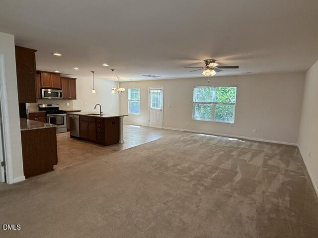 8147 Feldwig Place Raleigh, NC 27616 - Photo 3 of 13 feldwig kitchen and living