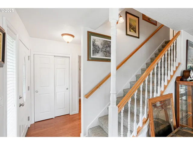 a view of an entryway with wooden floor