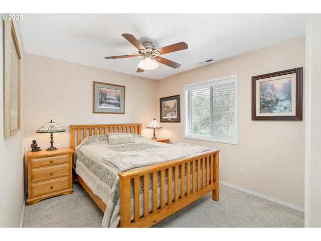 a bedroom with furniture and window