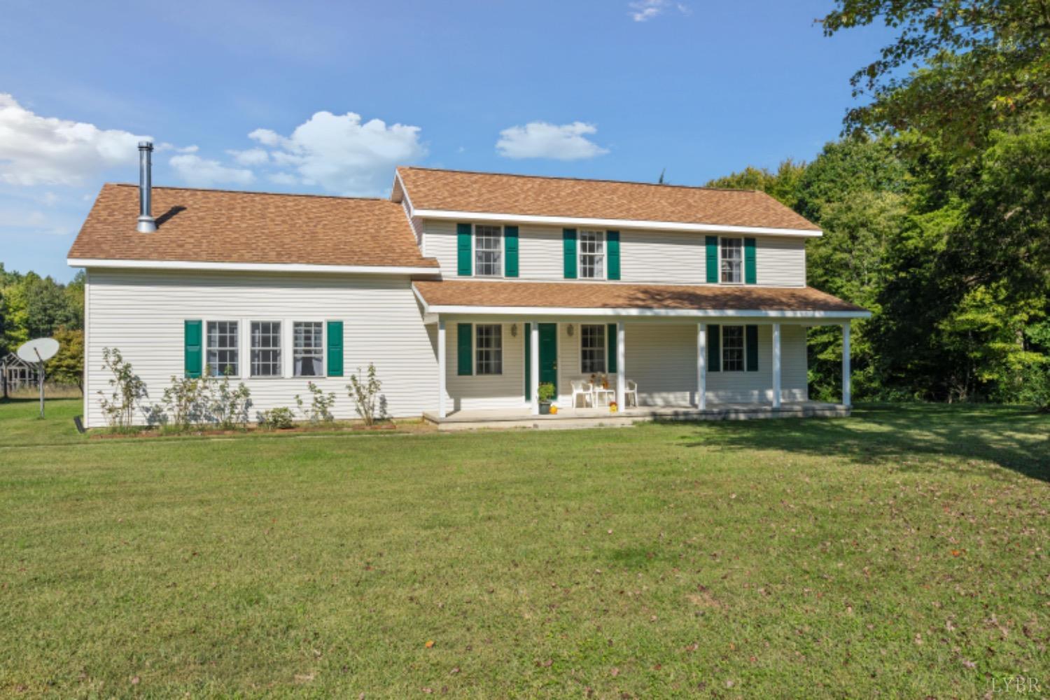 717 McDaniel Road Java, VA 24565 - Photo 54 of 60 a front view of a house with a garden