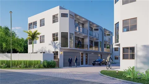 a front view of a building with sitting area