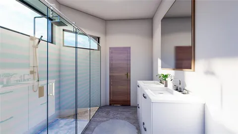 a bathroom with a granite countertop sink a mirror and shower