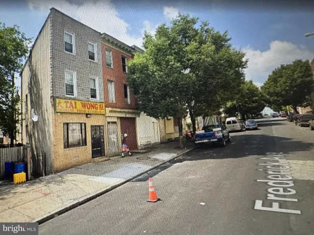 a view of a street with cars