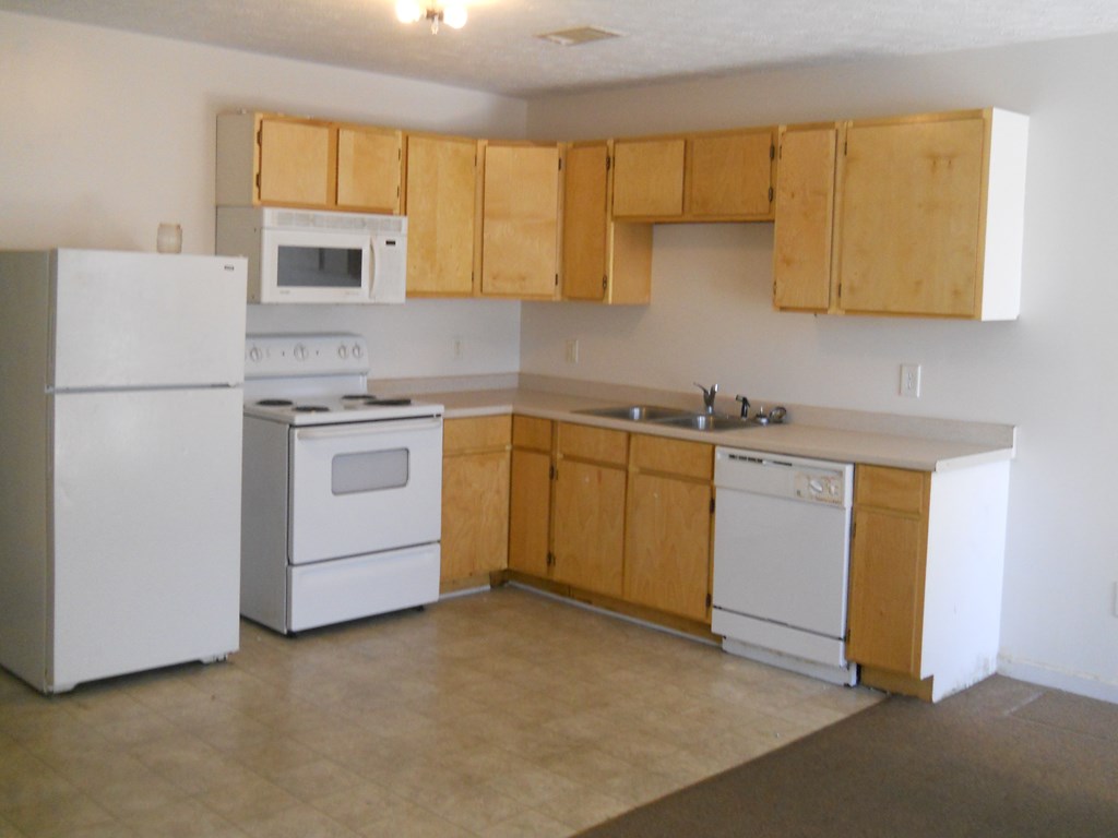 6 Montclair Court, Unit A Columbus, GA 31907 - Photo 2 of 2 a kitchen with a sink a stove and refrigerator