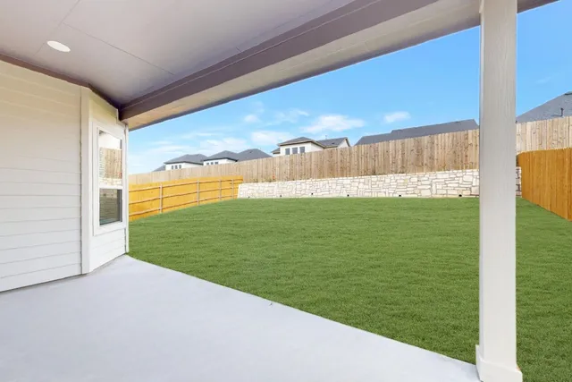 a view of a field with an outdoor space