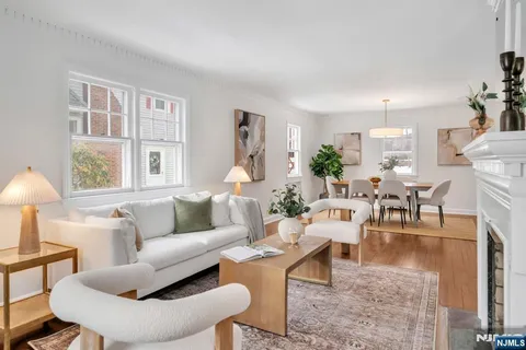 a view of a bedroom with wooden floor and a bathroom