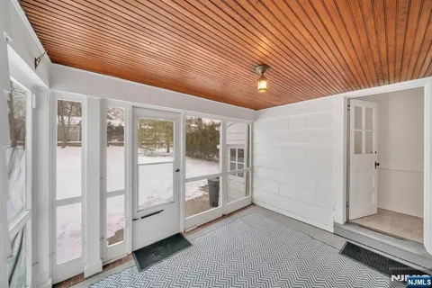 a utility room with cabinets washer and dryer