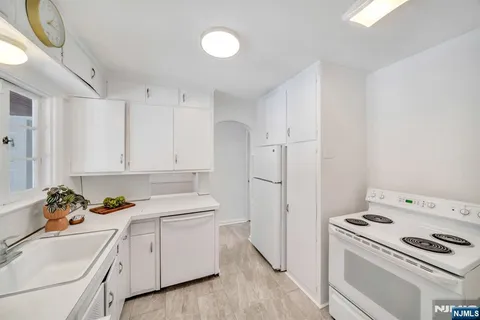 a view of a hallway with dining area