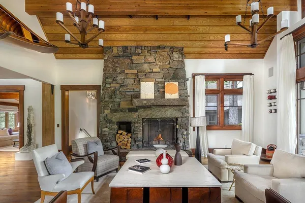 a living room with furniture window and a fireplace