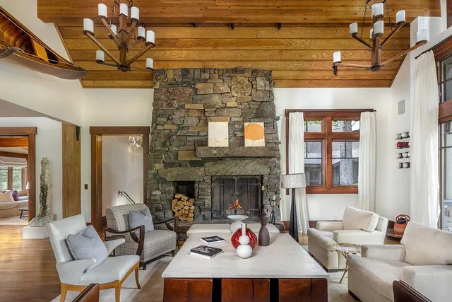a living room with furniture window and a fireplace