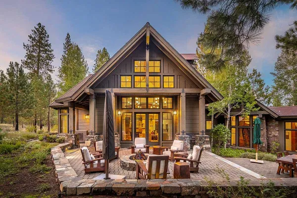 a view of a house with backyard porch and sitting area