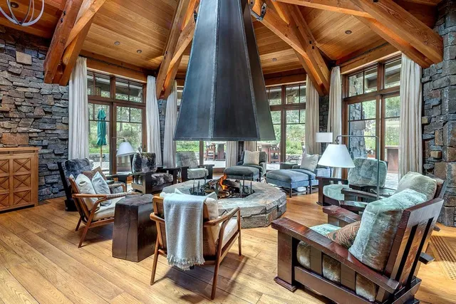 a living room with furniture a window and a fireplace