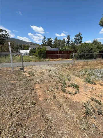 a view of a yard with a trampoline