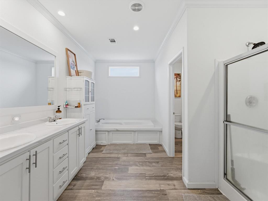 466 Belcher Road Bowie, TX 76230 - Photo 11 of 40 a bathroom with a sink a toilet and shower