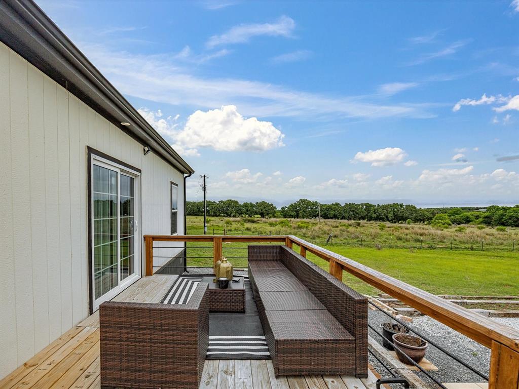 466 Belcher Road Bowie, TX 76230 - Photo 32 of 40 a view of swimming pool with a lounge chair