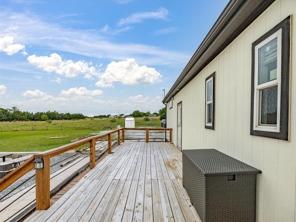 466 Belcher Road Bowie, TX 76230 - Photo 33 of 40 a view of balcony with hardwood floor and lake view