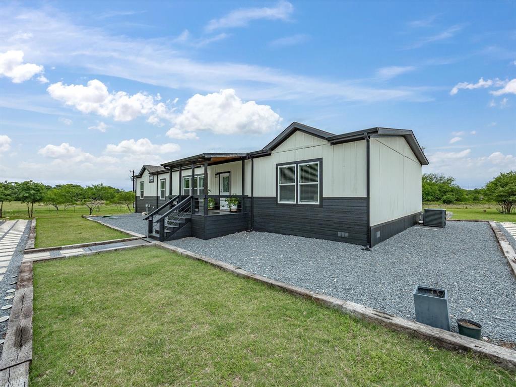 466 Belcher Road Bowie, TX 76230 - Photo 7 of 40 a view of house with yard and entertaining space