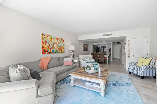 a living room with furniture and a table