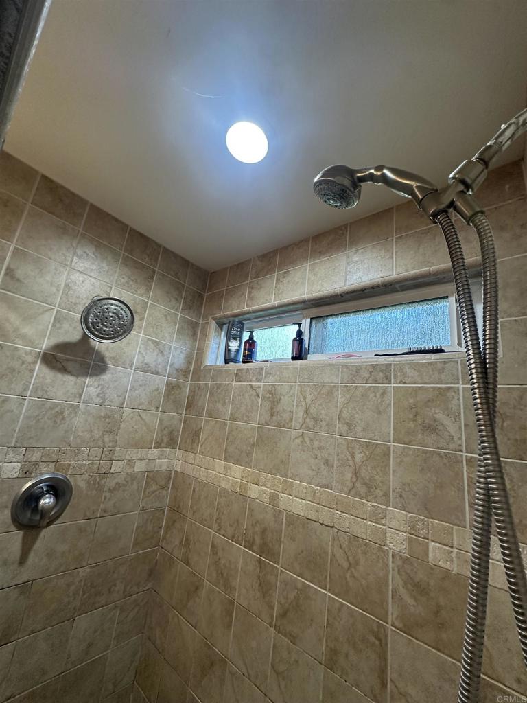 13907 Maxfield Road Jamul, CA 91935 - Photo 23 of 32 a bathroom with a shower