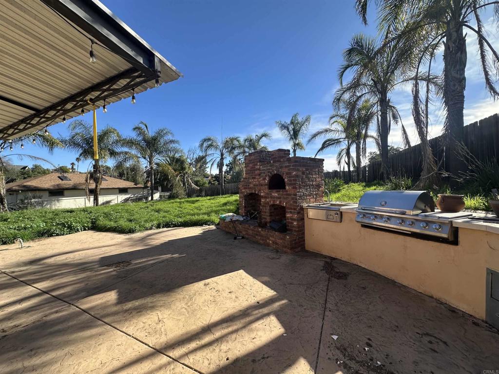 13907 Maxfield Road Jamul, CA 91935 - Photo 30 of 32 a view of a patio with couches and a fire pit