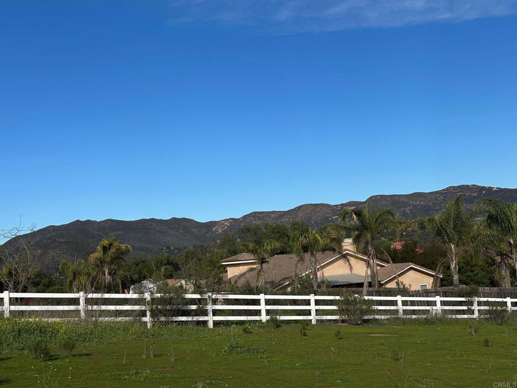 13907 Maxfield Road Jamul, CA 91935 - Photo 5 of 32 a view of houses with green field and mountains