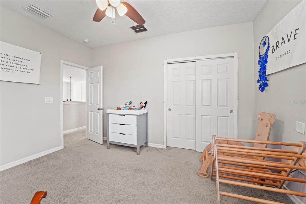 8903 Arabella Lane Seminole, FL 33777 - Photo 28 of 47 a view of a bedroom with closet