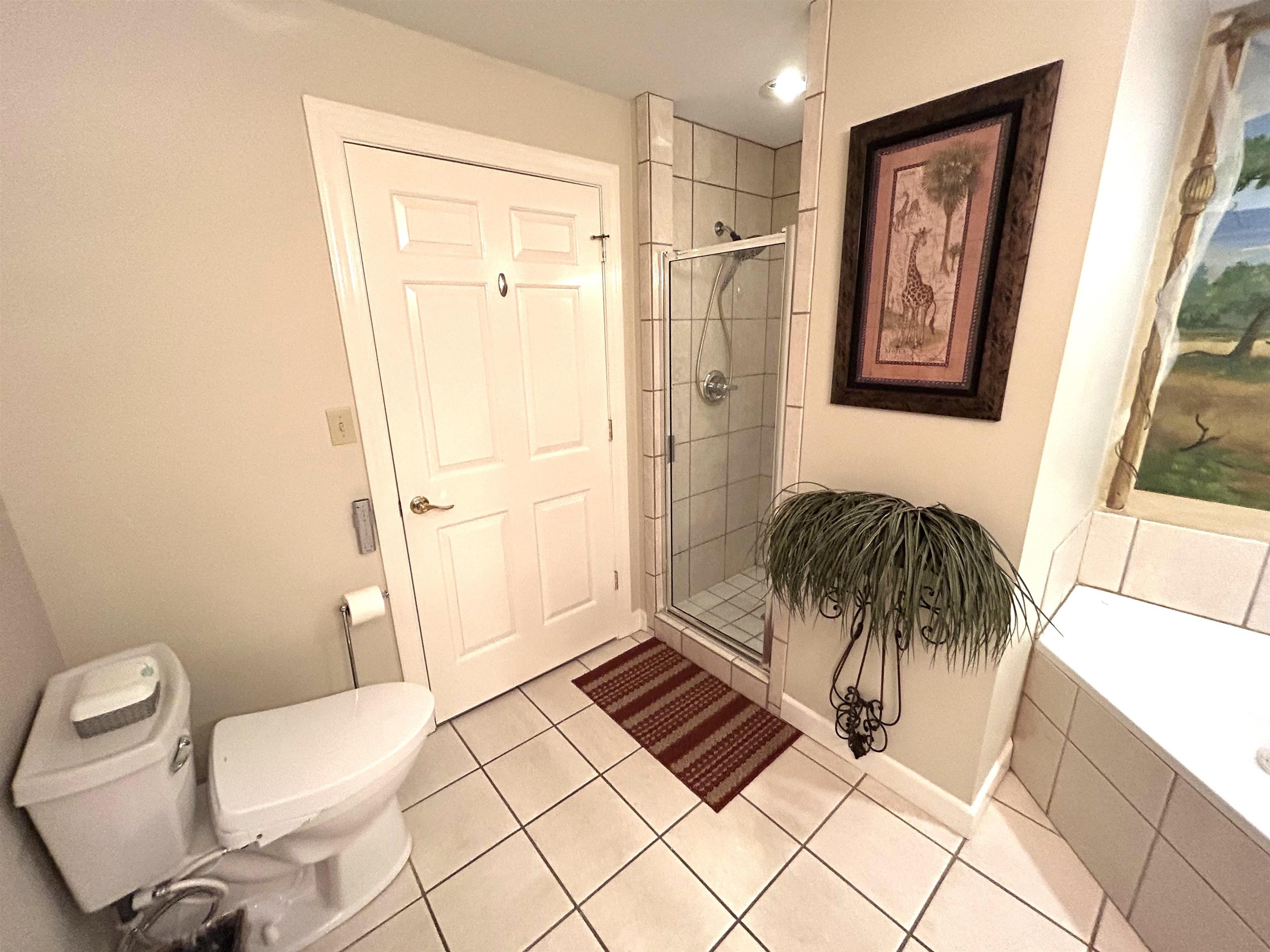 380 Rd Iuka Ms 38852, Unit P 402 Iuka, MS 38852 - Photo 13 of 25 a view of a bathroom with a toilet and a shower