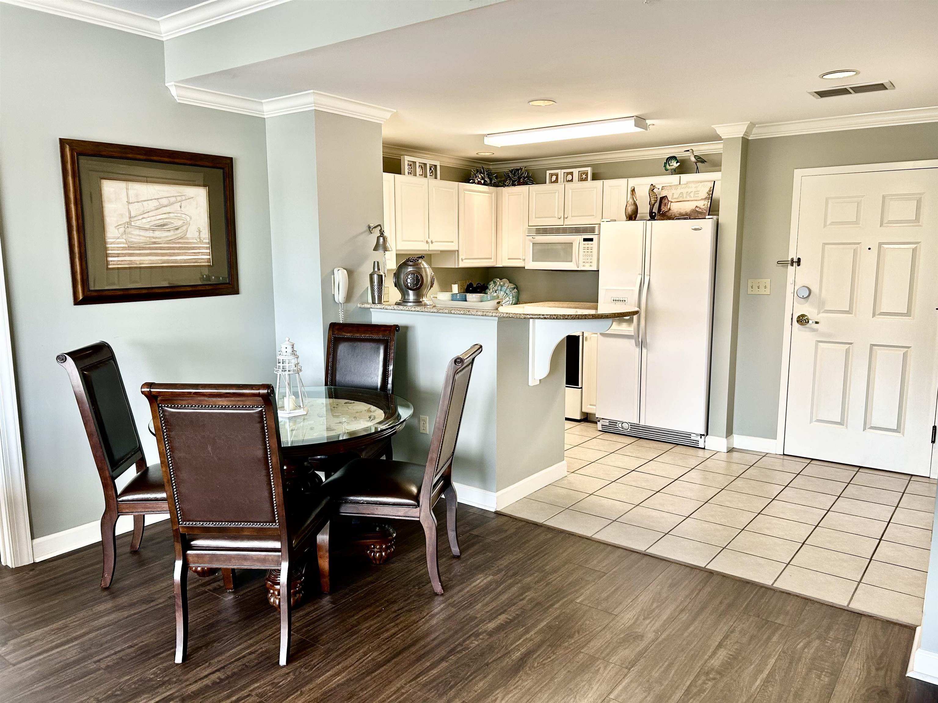 380 Rd Iuka Ms 38852, Unit P 402 Iuka, MS 38852 - Photo 8 of 25 a view of a dining room with furniture and wooden floor