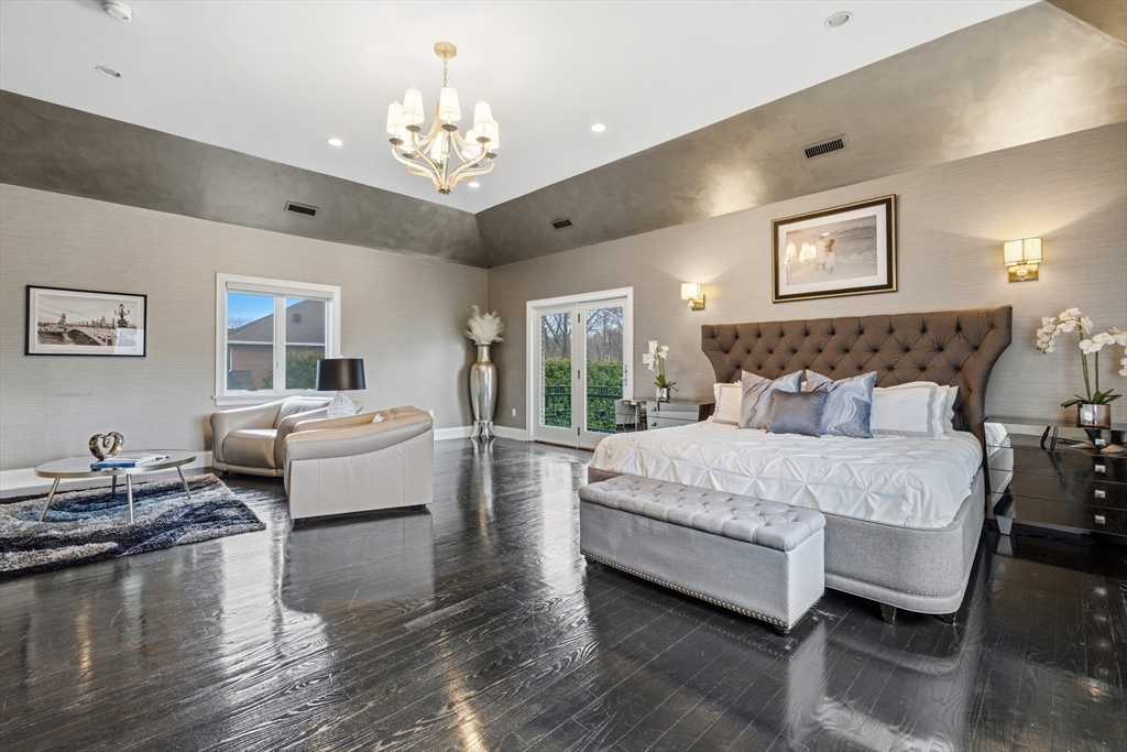 7 Freeman Street Lynnfield, MA 01940 - Photo 21 of 39 a spacious bedroom with a bed and wooden floor