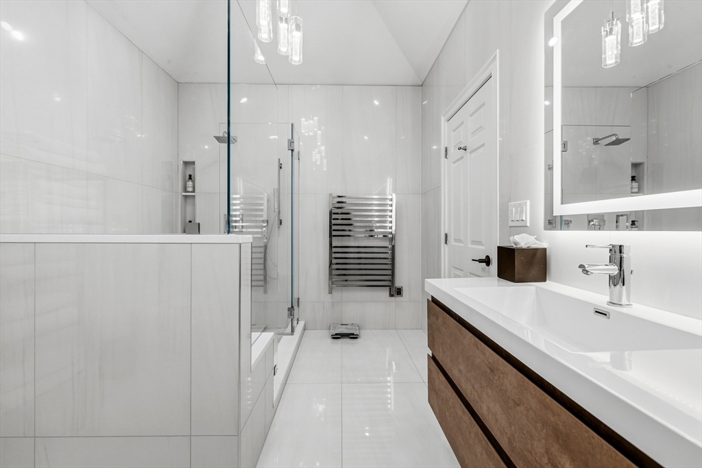7 Freeman Street Lynnfield, MA 01940 - Photo 24 of 39 a bathroom with a double vanity sink a shower and a mirror
