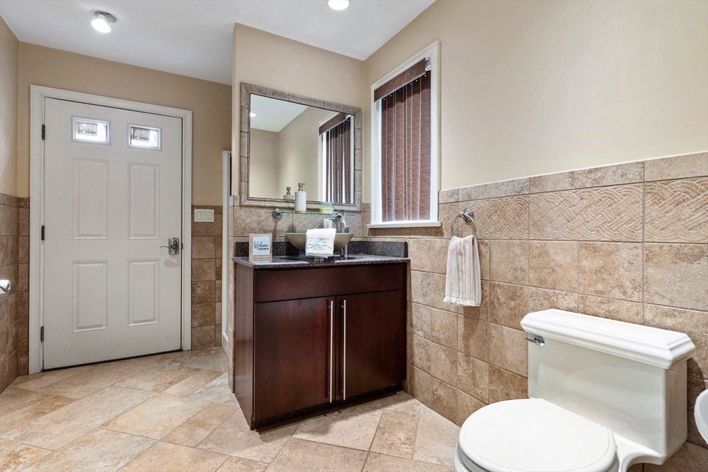 7 Freeman Street Lynnfield, MA 01940 - Photo 32 of 39 a bathroom with a toilet a sink and a mirror