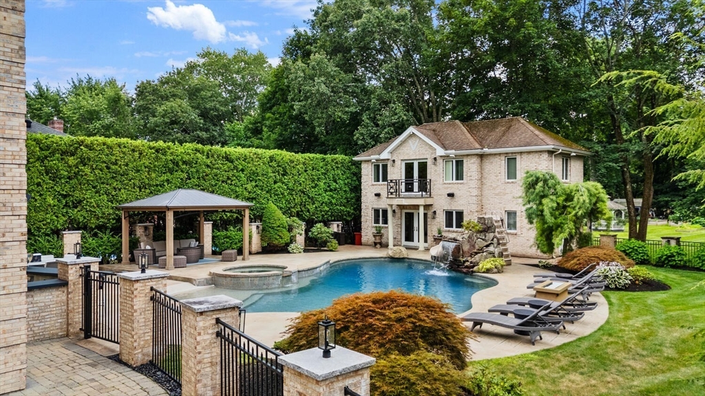 7 Freeman Street Lynnfield, MA 01940 - Photo 4 of 39 a front view of a house with swimming pool garden and patio