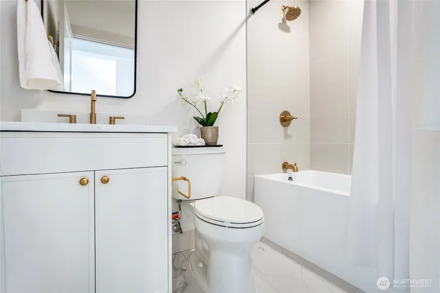 a bedroom with two bed and a table