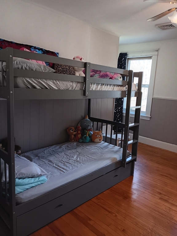 28 Barnard Road Worcester, MA 01605 - Photo 13 of 20 a bedroom with a bed and wooden floor