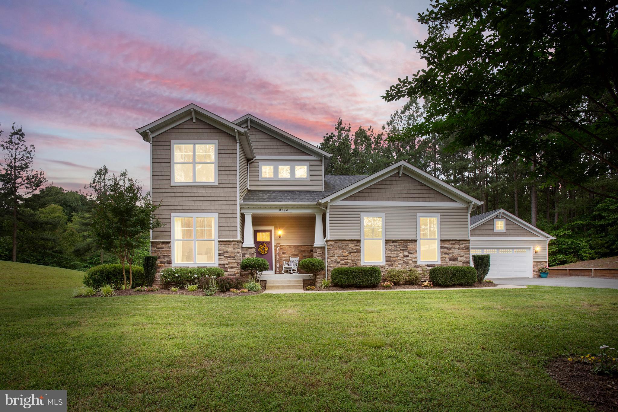 8264 Buckthorne Run King George, VA 22485 - Photo 1 of 50 a front view of a house with a yard and garage