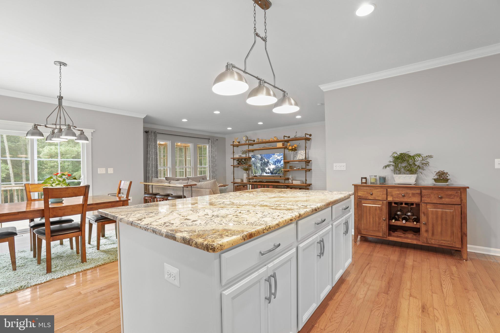 8264 Buckthorne Run King George, VA 22485 - Photo 14 of 50 a kitchen with a stove and chairs