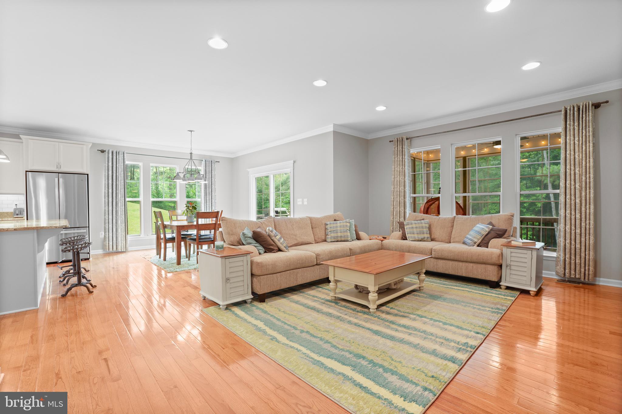 8264 Buckthorne Run King George, VA 22485 - Photo 22 of 50 a living room with furniture and a large window