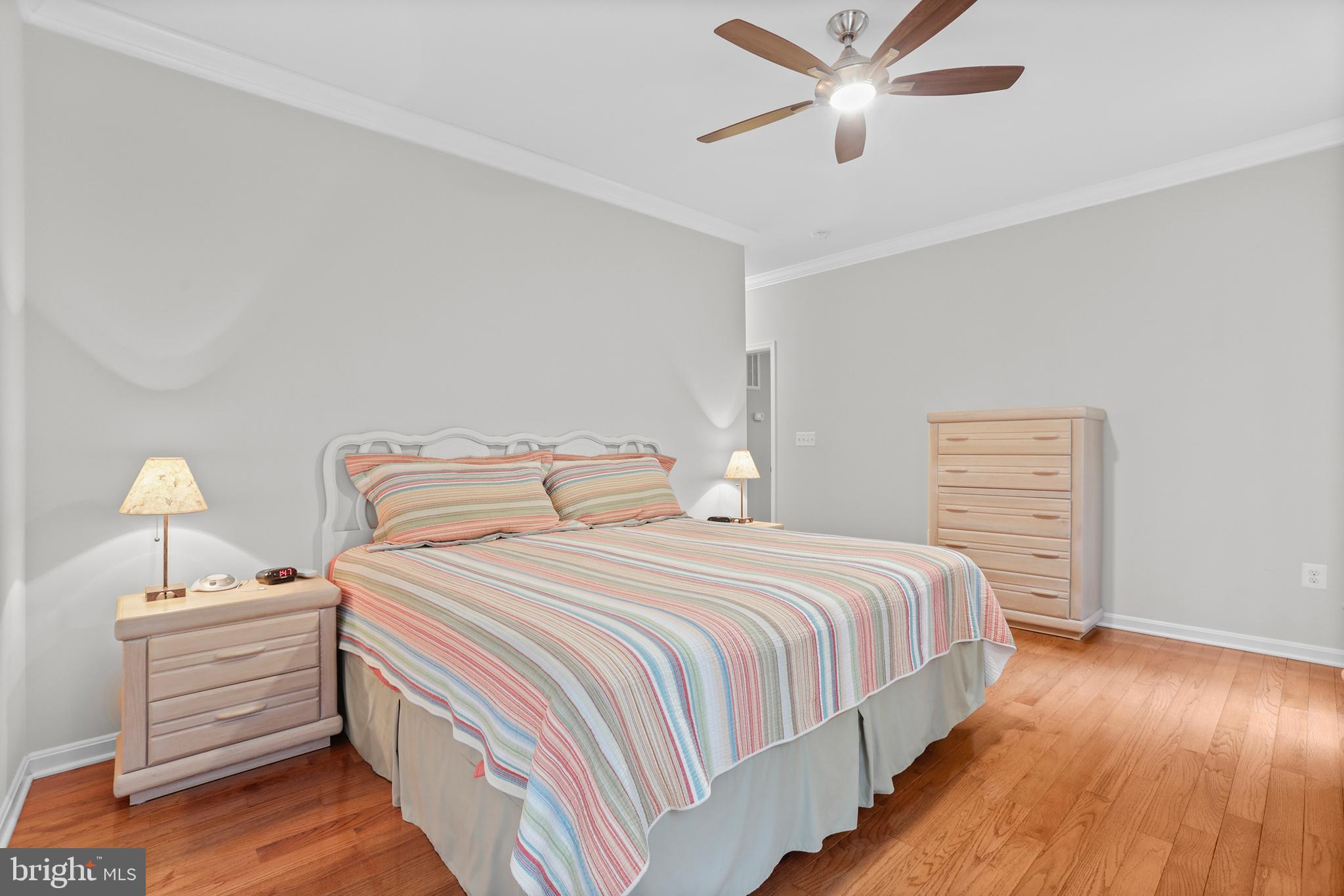 8264 Buckthorne Run King George, VA 22485 - Photo 26 of 50 a bedroom with a bed and wooden floor