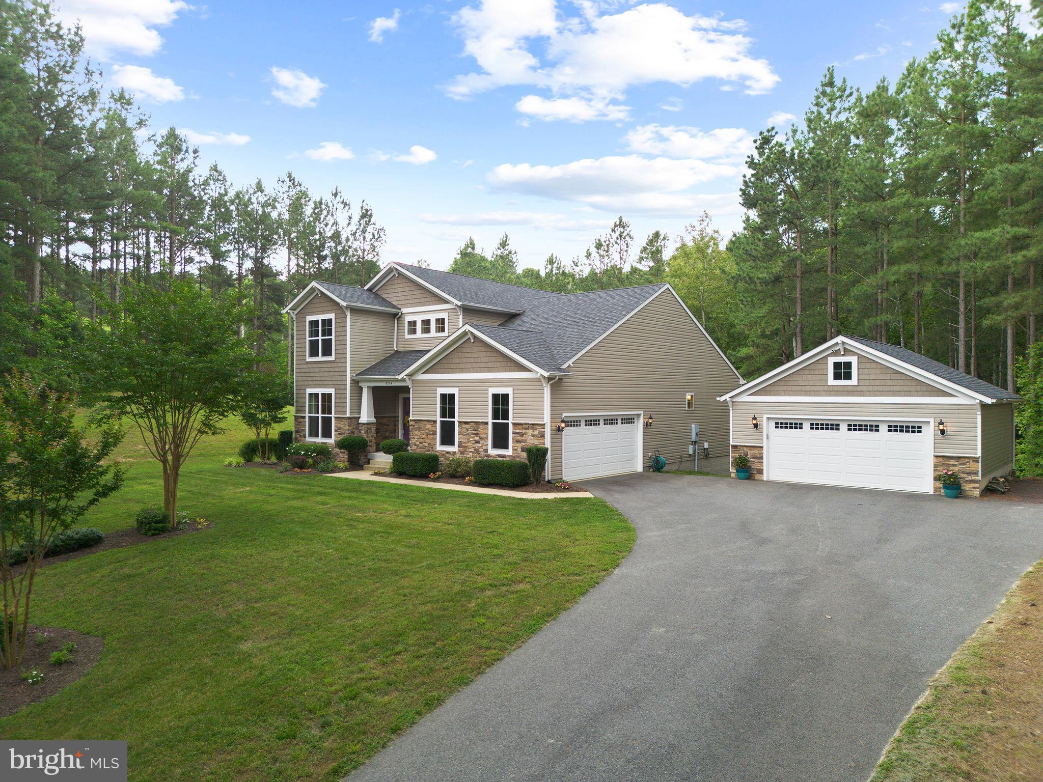 8264 Buckthorne Run King George, VA 22485 - Photo 3 of 50 a front view of a house with a yard