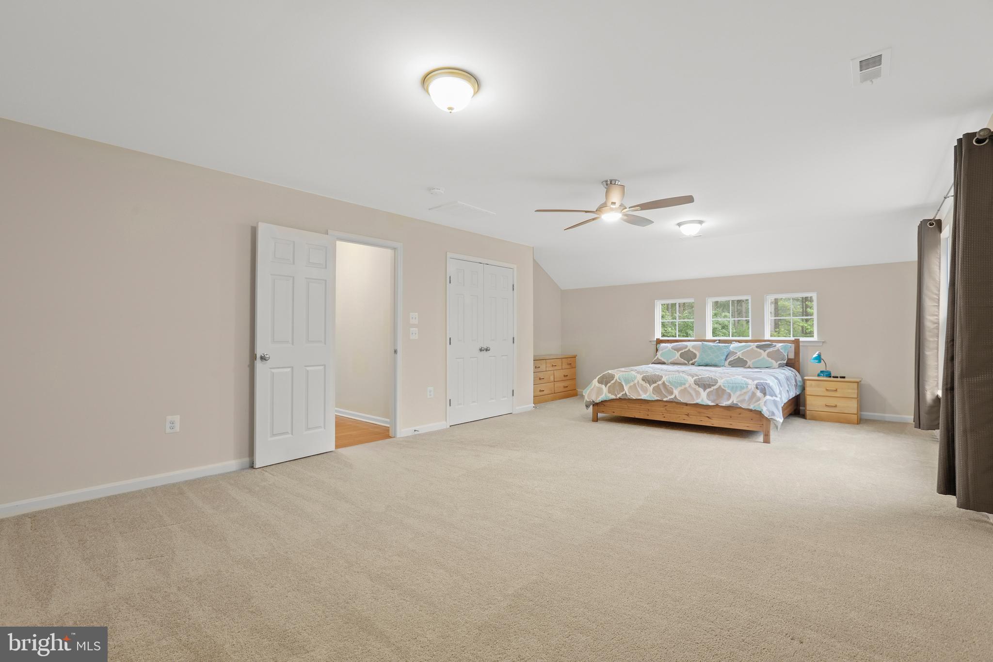 8264 Buckthorne Run King George, VA 22485 - Photo 35 of 50 a view of a livingroom with furniture and a ceiling fan